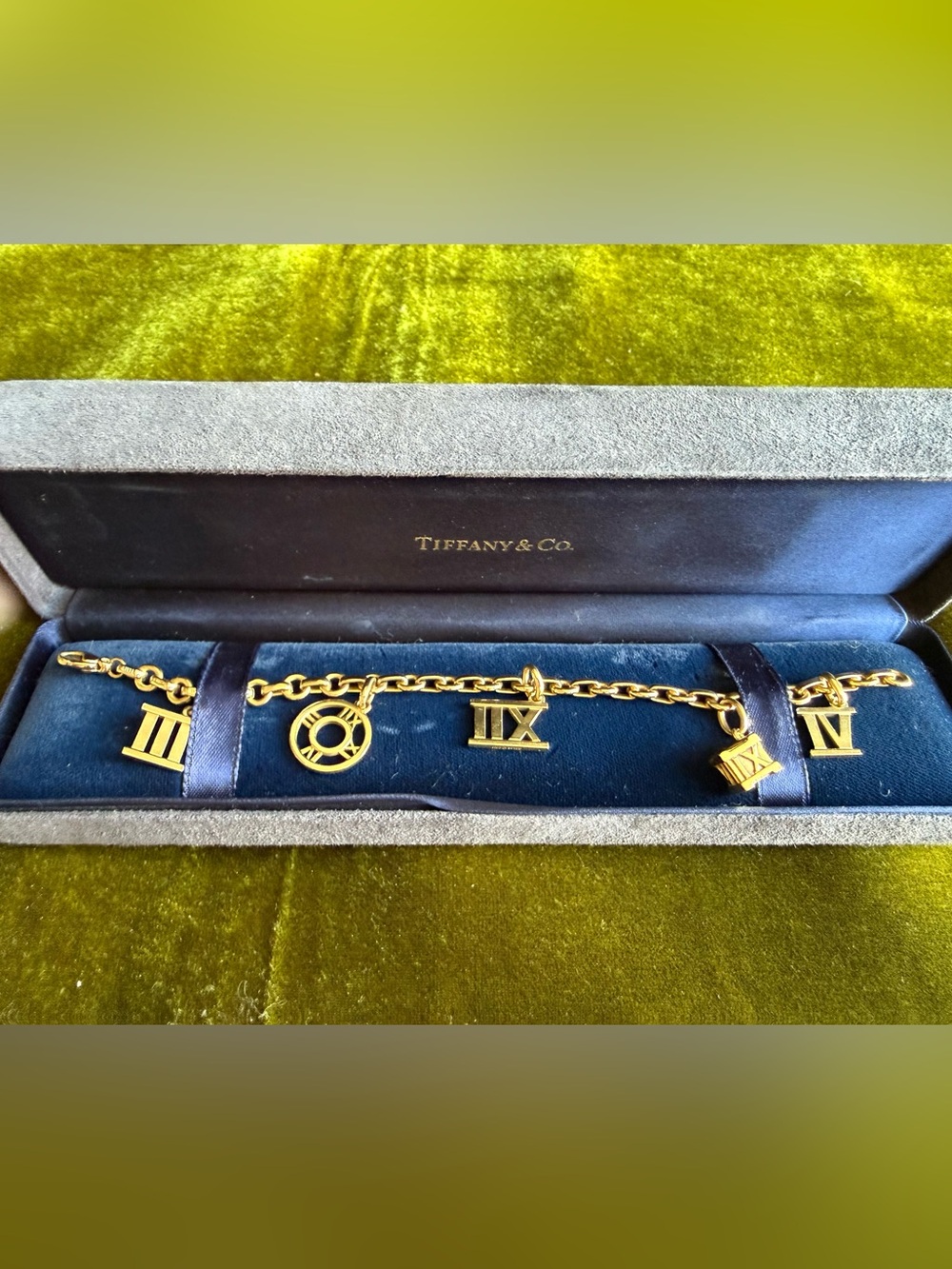 Tiffany & Co. 18k Gold Atlas collection Roman Numeral Charm Bracelet
